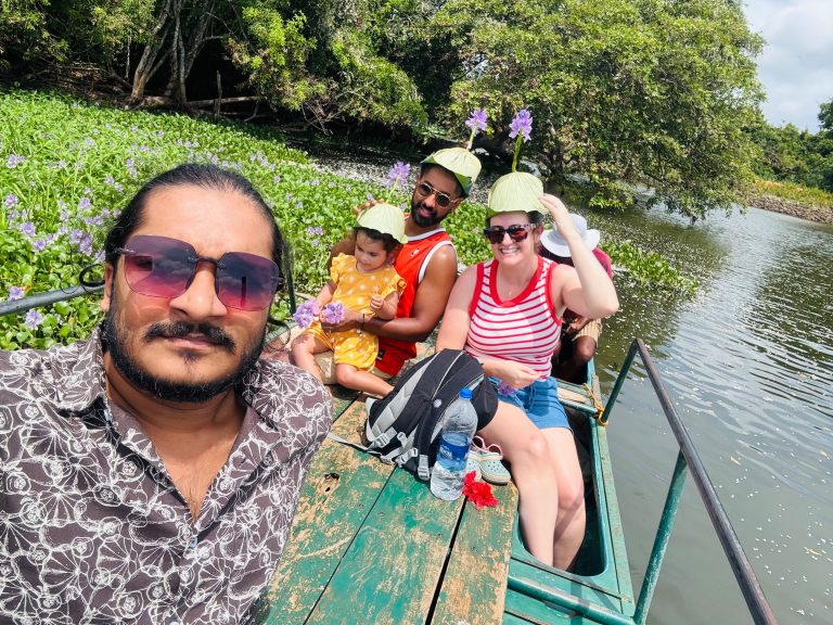 Travellers enjoying a scenic boat ride on lotus lake in Sri Lanka with Olanka Tours