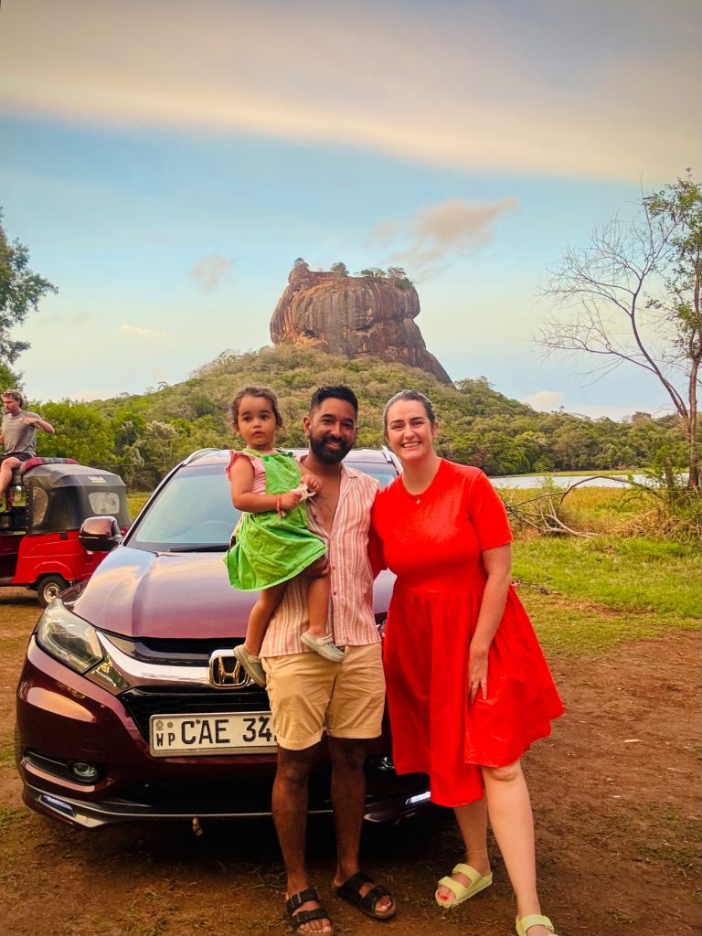 Family with Olanka Tours private vehicle in front of Sigiriya Rock Fortress